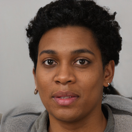 Neutral black young-adult female with short  black hair and brown eyes