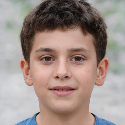 Joyful white child male with short  brown hair and brown eyes