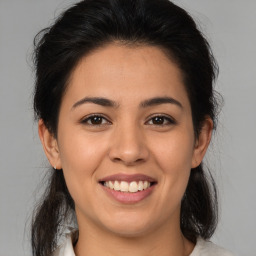 Joyful asian young-adult female with medium  brown hair and brown eyes