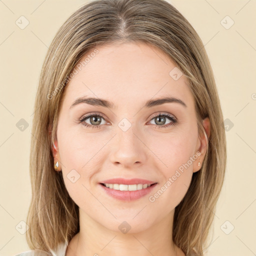 Joyful white young-adult female with medium  brown hair and green eyes