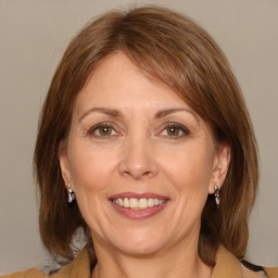 Joyful white adult female with medium  brown hair and brown eyes