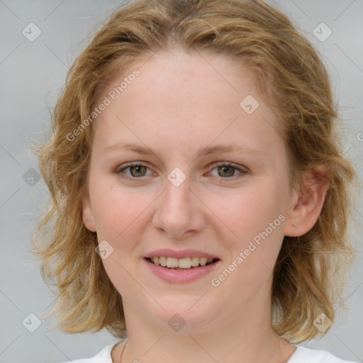 Joyful white young-adult female with medium  brown hair and blue eyes