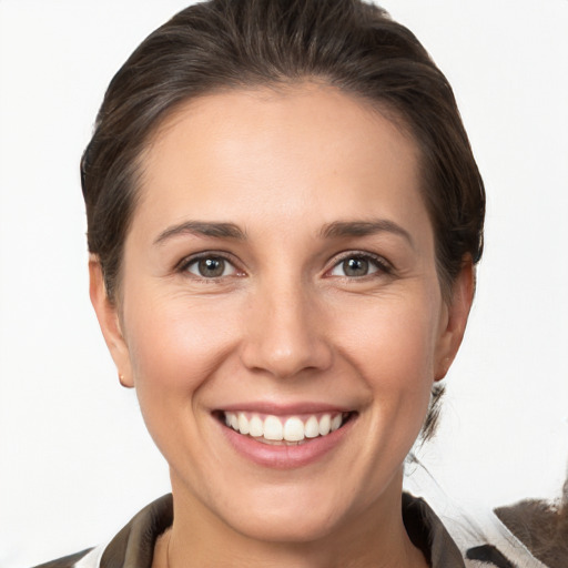 Joyful white young-adult female with medium  brown hair and brown eyes