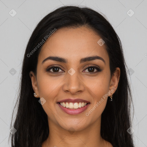 Joyful latino young-adult female with long  brown hair and brown eyes