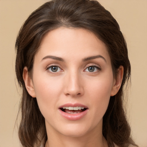 Joyful white young-adult female with medium  brown hair and brown eyes