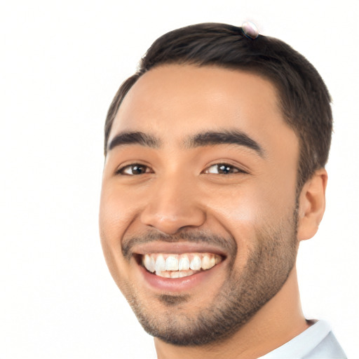 Joyful latino young-adult male with short  black hair and brown eyes