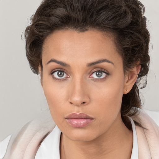 Neutral white young-adult female with medium  brown hair and brown eyes