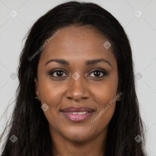 Joyful black young-adult female with long  brown hair and brown eyes