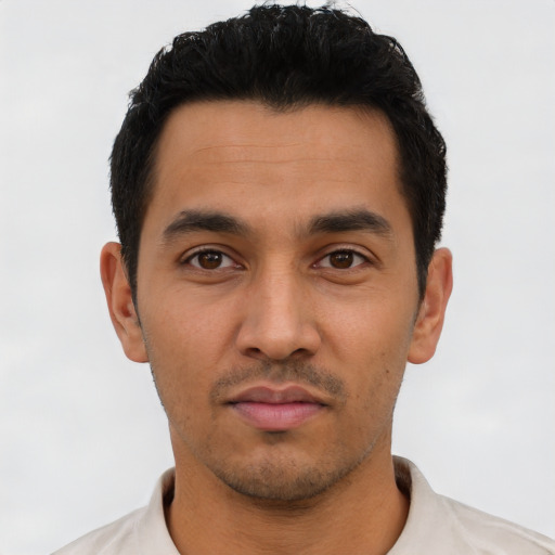 Neutral latino young-adult male with short  black hair and brown eyes