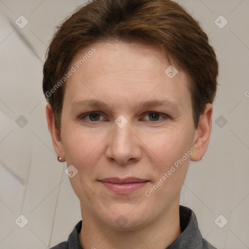 Joyful white adult female with short  brown hair and grey eyes