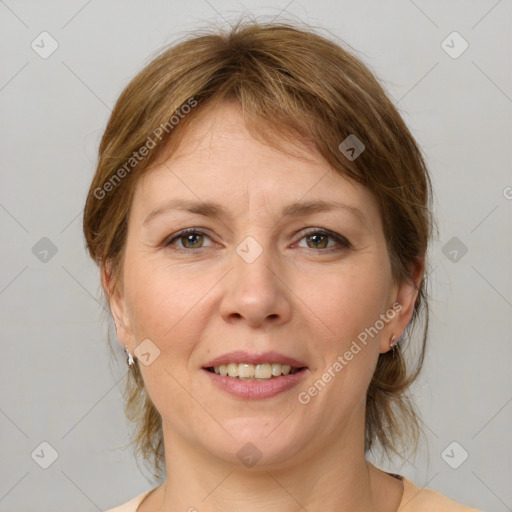 Joyful white adult female with medium  brown hair and grey eyes