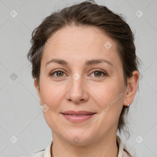 Joyful white adult female with short  brown hair and grey eyes