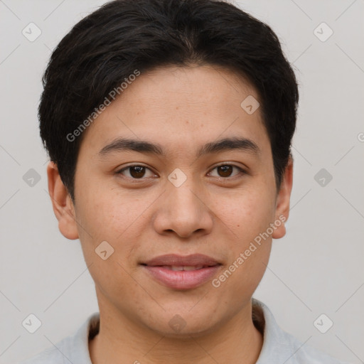 Joyful asian young-adult male with short  brown hair and brown eyes