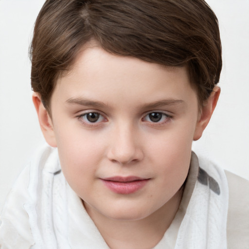 Joyful white child female with short  brown hair and brown eyes