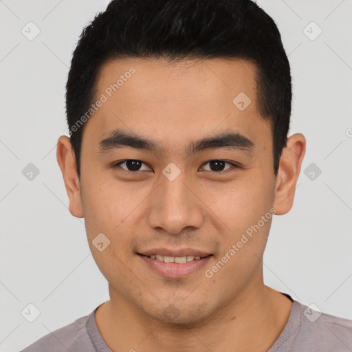 Joyful latino young-adult male with short  black hair and brown eyes