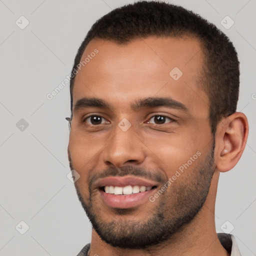 Joyful white young-adult male with short  black hair and brown eyes