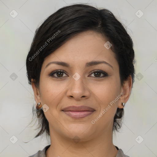 Joyful latino young-adult female with medium  brown hair and brown eyes
