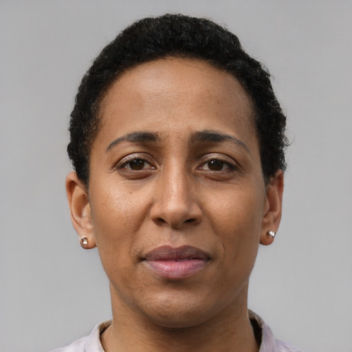 Neutral latino adult female with short  black hair and brown eyes