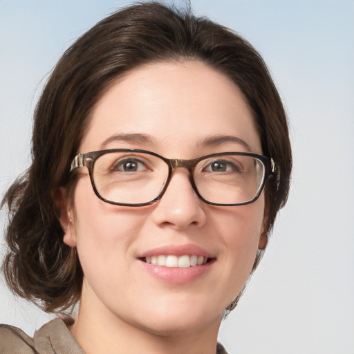 Joyful white young-adult female with medium  brown hair and blue eyes