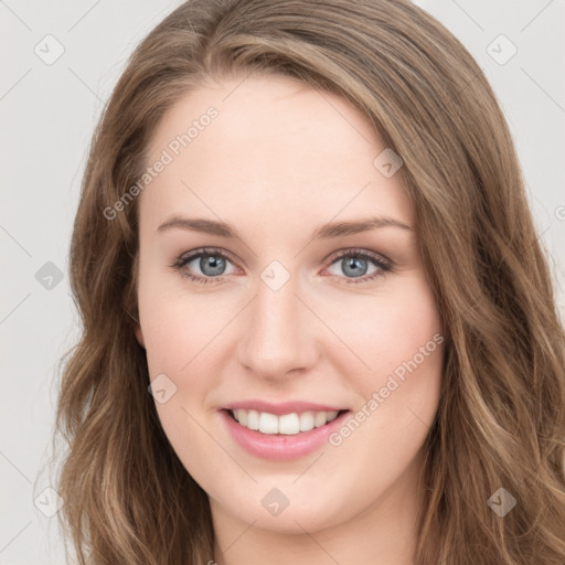 Joyful white young-adult female with long  brown hair and green eyes