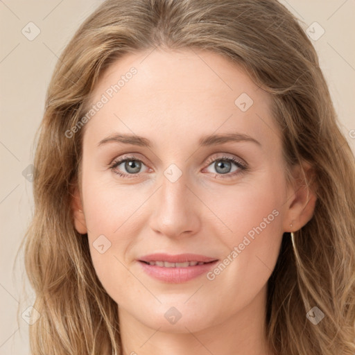 Joyful white young-adult female with long  brown hair and green eyes