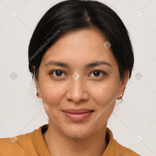 Joyful latino young-adult female with medium  brown hair and brown eyes