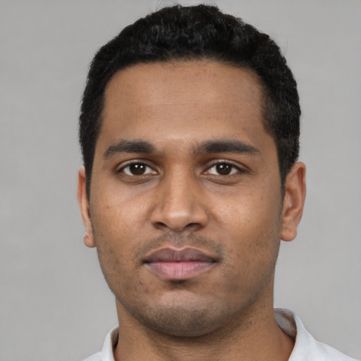 Neutral black young-adult male with short  black hair and brown eyes