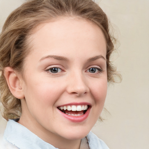 Joyful white young-adult female with medium  brown hair and blue eyes