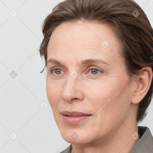 Joyful white adult female with short  brown hair and grey eyes