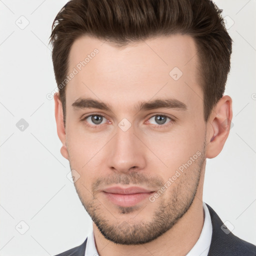 Neutral white young-adult male with short  brown hair and brown eyes