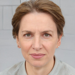 Joyful white adult female with short  brown hair and brown eyes