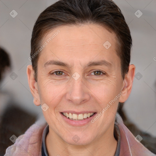 Joyful white adult female with short  brown hair and brown eyes