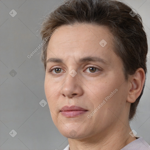 Joyful white adult female with short  brown hair and brown eyes