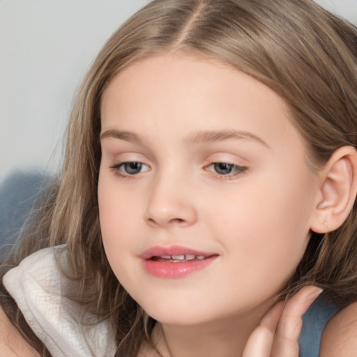 Joyful white child female with long  brown hair and brown eyes