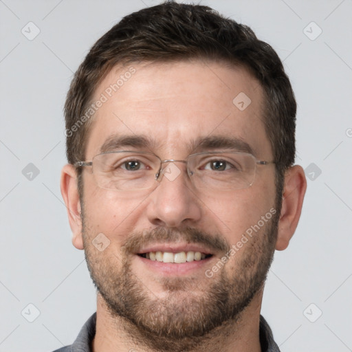 Joyful white adult male with short  brown hair and brown eyes