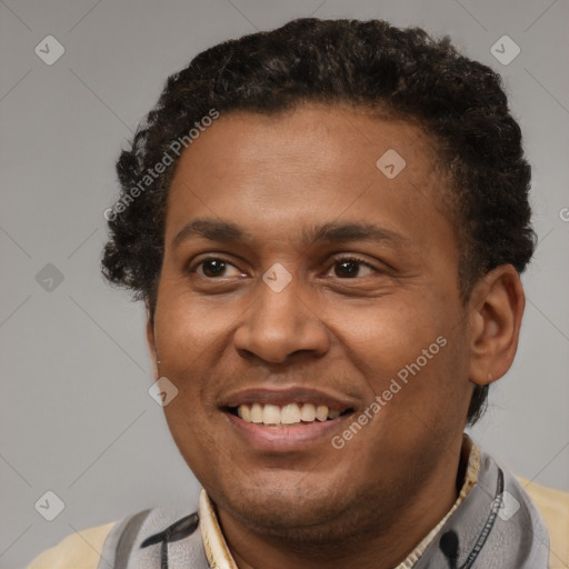 Joyful latino adult male with short  brown hair and brown eyes