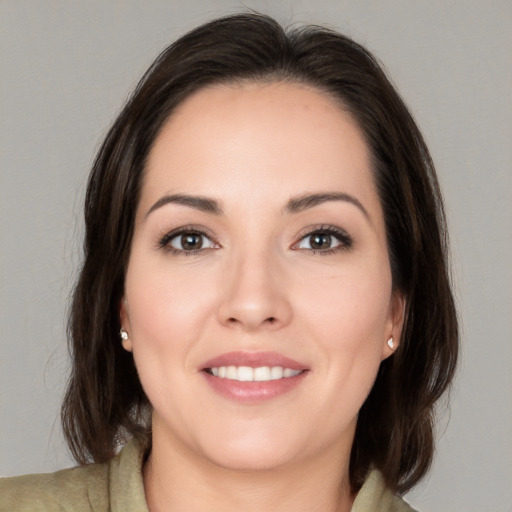 Joyful white young-adult female with medium  brown hair and brown eyes