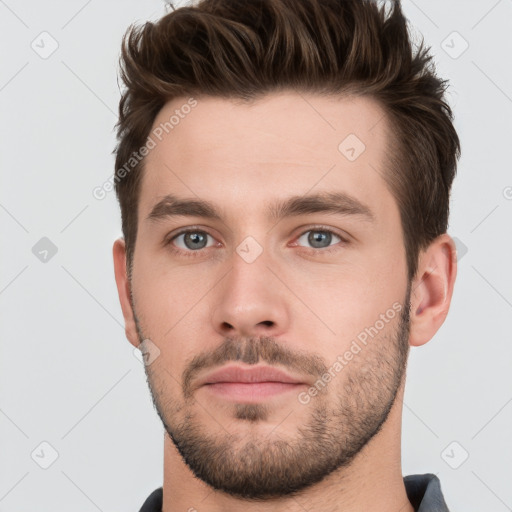 Neutral white young-adult male with short  brown hair and brown eyes