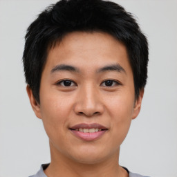 Joyful asian young-adult male with short  brown hair and brown eyes