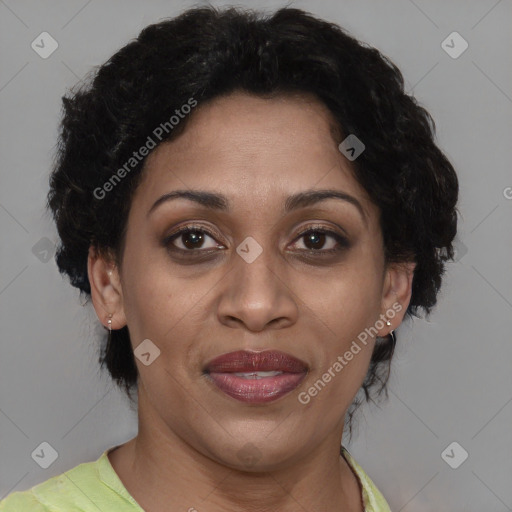 Joyful black adult female with short  brown hair and brown eyes