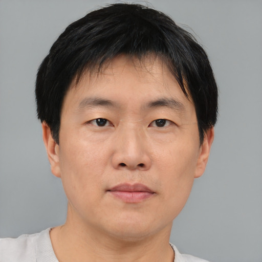Neutral asian young-adult male with short  black hair and brown eyes