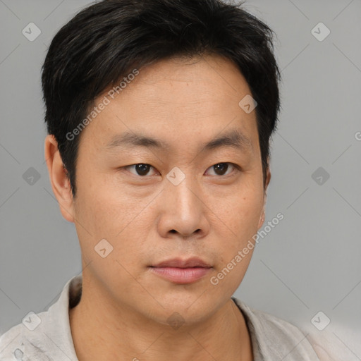 Neutral asian young-adult male with short  brown hair and brown eyes