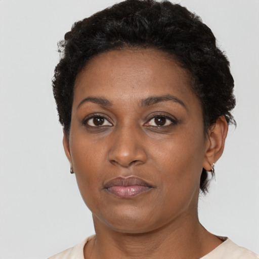 Neutral black adult female with short  black hair and brown eyes