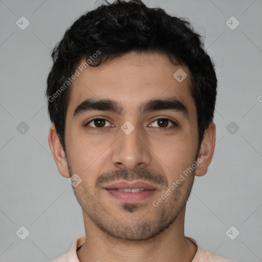 Joyful white young-adult male with short  black hair and brown eyes