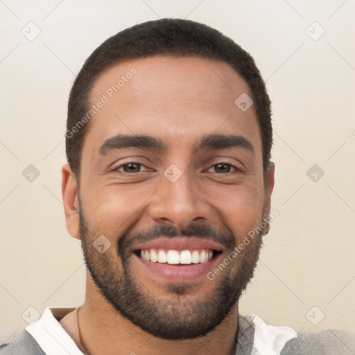 Joyful white young-adult male with short  black hair and brown eyes