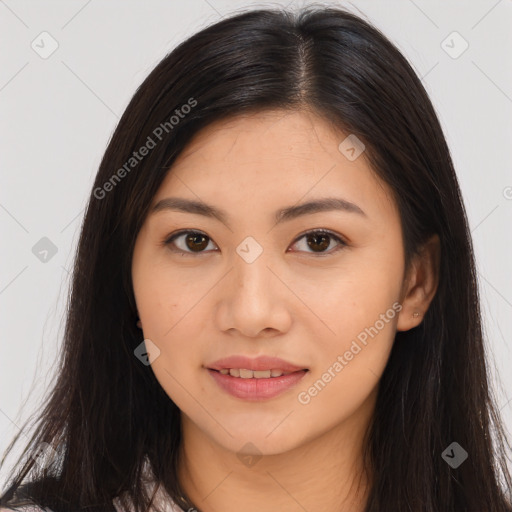 Joyful asian young-adult female with long  brown hair and brown eyes