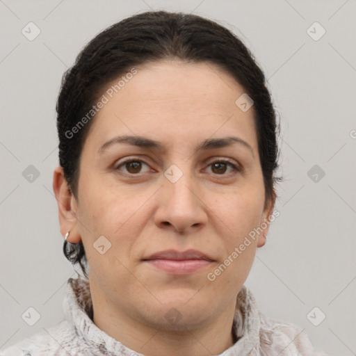 Joyful white adult female with short  brown hair and brown eyes