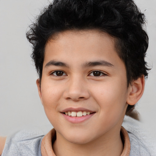 Joyful asian child male with short  brown hair and brown eyes