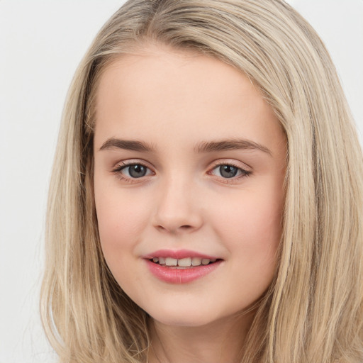 Joyful white child female with long  brown hair and brown eyes