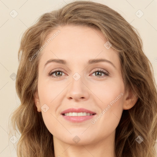 Joyful white young-adult female with long  brown hair and green eyes